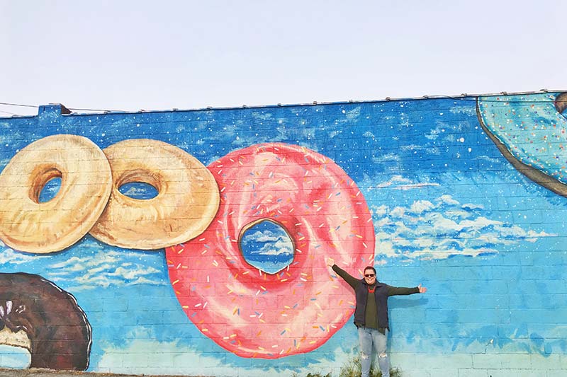 Hannah in front of the doughnut mural in Chattanooga