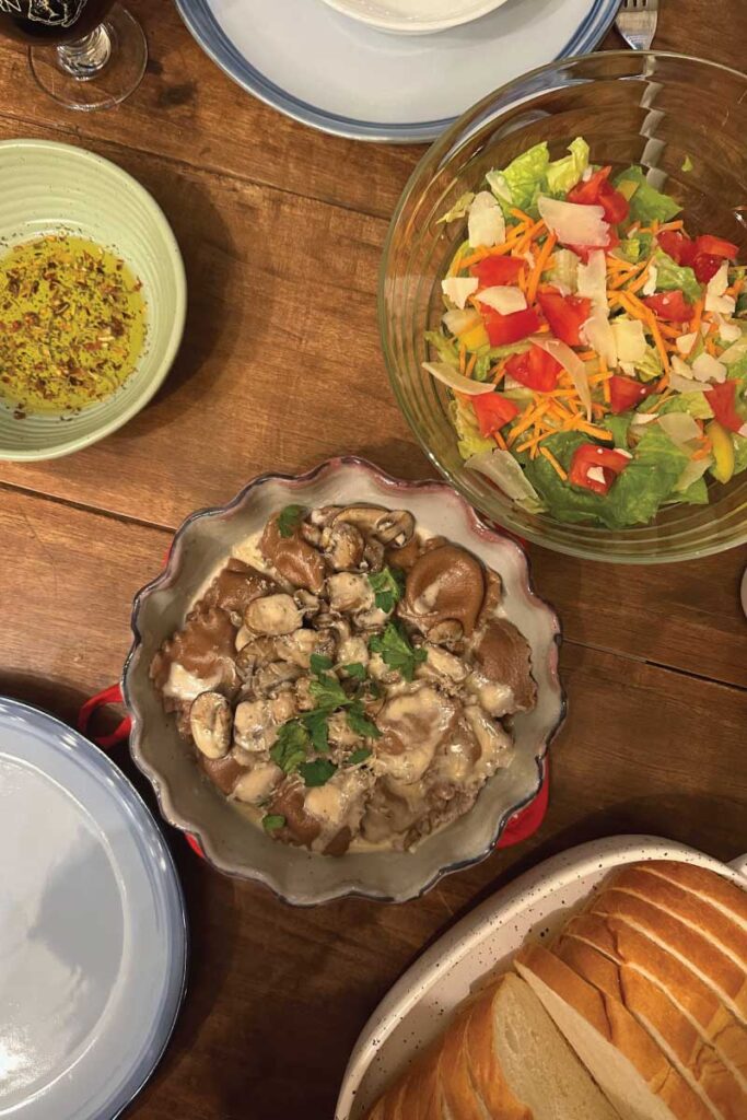 homemade mushroom pasta, salad, and bread